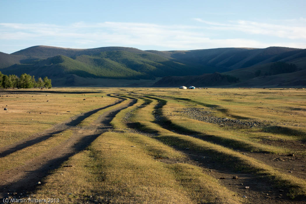 Mongolia: 10/6 Tsetserleg - Kumirnya Tusukhaley / Tracks in the setting sun. Click to see full size image